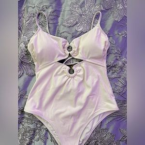 White one piece never used, only tried on. Never been worn or washed. NWOT